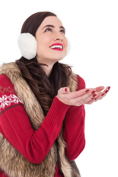 Brunette in winter clothes with hands out — Stock Photo, Image