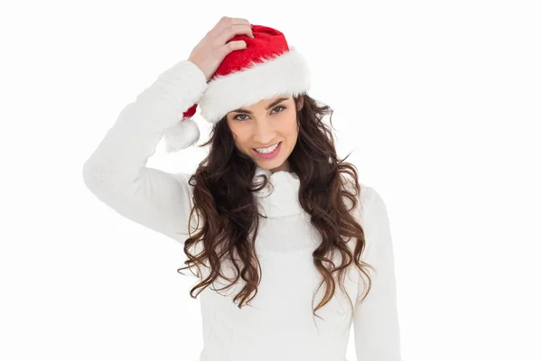 Confused brunette in santa hat — Stock Photo, Image