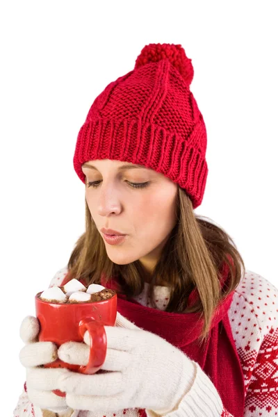 Festive girl blowing over mug — Stock Photo, Image