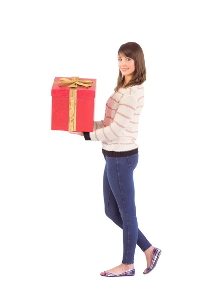 Smiling woman holding a gift — Stock Photo, Image