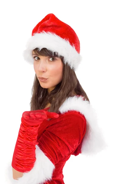 Pretty girl in santa costume holding hand out — Stock Photo, Image