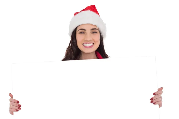 Lachende brunette in Kerstman hoed witte poster weergegeven: — Stockfoto