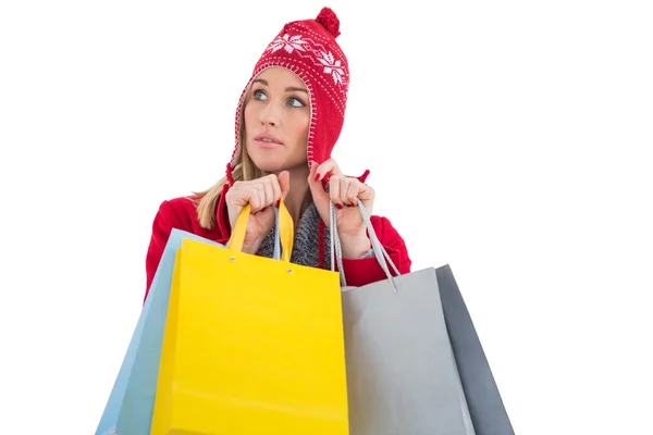 Blonde in winter clothes holding shopping bags — Stock Photo, Image