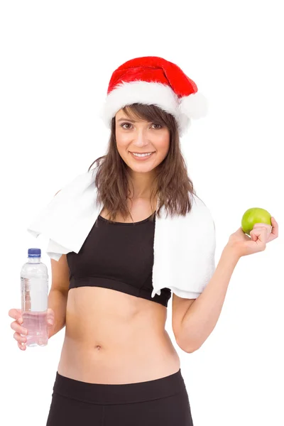 Festive fit brunette smiling at camera — Stock Photo, Image