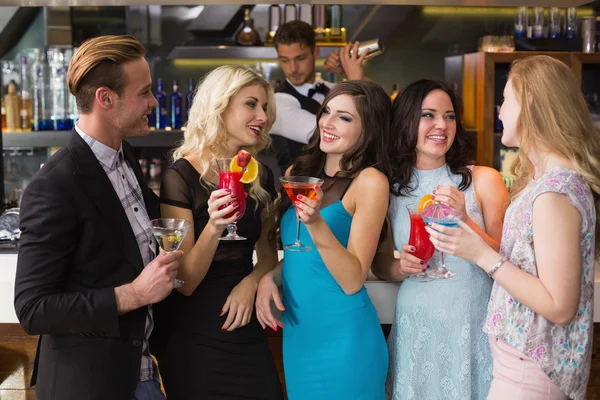 Attractive friends drinking cocktails together — Stock Photo, Image