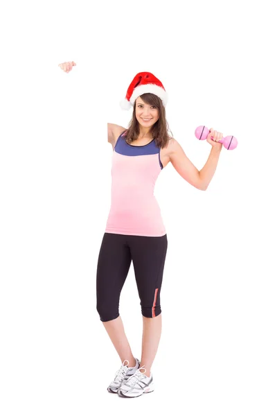 Festive fit brunette smiling at camera holding poster — Stock Photo, Image