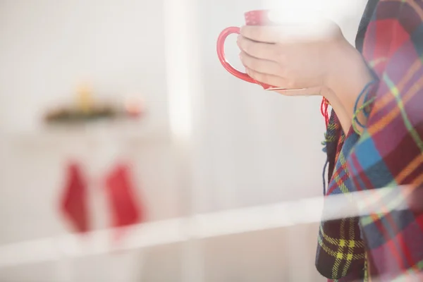 Woman with cover holding mug — Stock Photo, Image