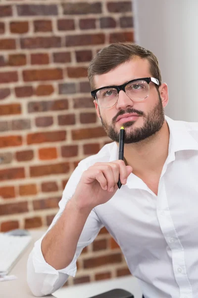 Thoughtful businessman in office — Stock Photo, Image