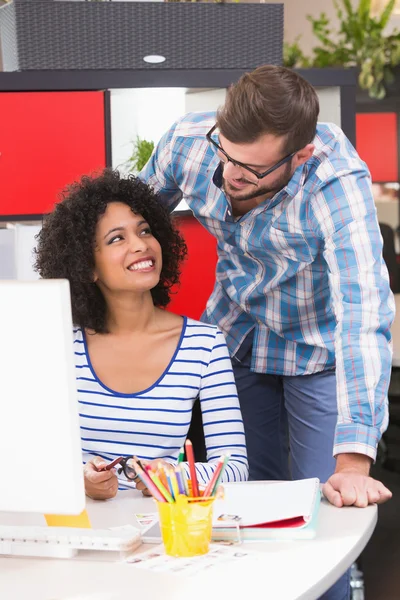 Smiling photo editors using computer — Stock Photo, Image