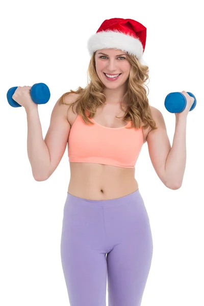 Festive fit blonde holding dumbbells — Stock Photo, Image