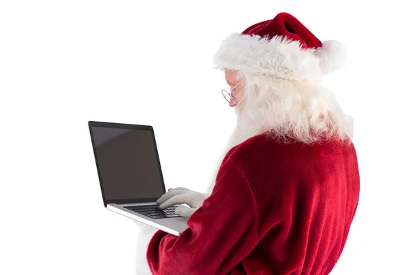 Weihnachtsmann benutzt Laptop — Stockfoto