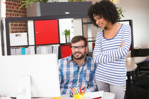 Smiling photo editors using computer — Stock Photo, Image