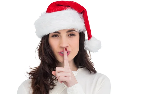 Festive brunette keeping a secret — Stock Photo, Image