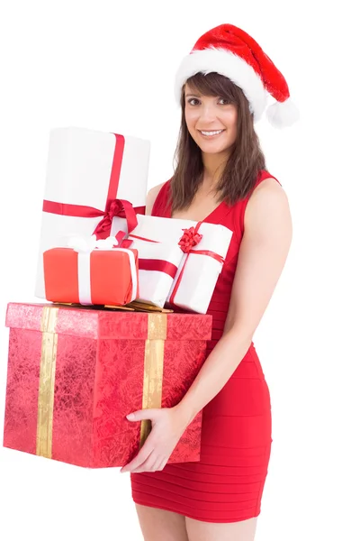 Feestelijke brunette houden stapel geschenken — Stockfoto