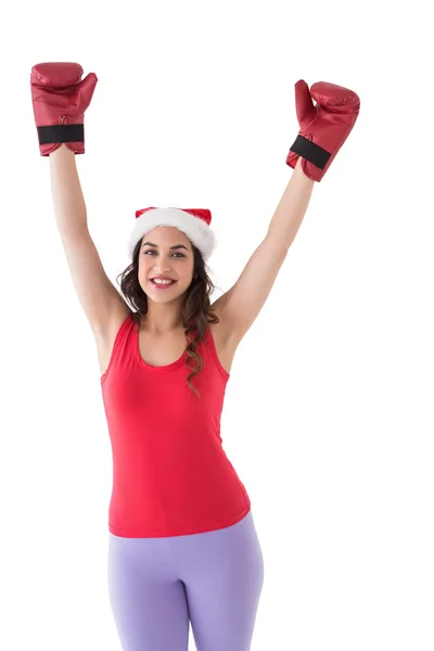 Festive brunette in boxing gloves cheering — Stock Photo, Image