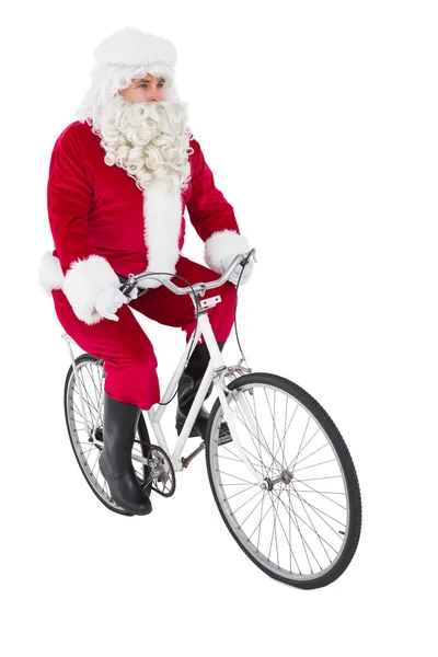 Cheerful father christmas cycling — Stock Photo, Image