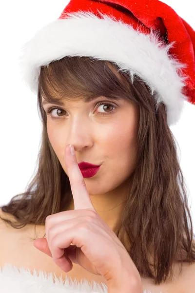 Festive brunette keeping a secret — Stock Photo, Image