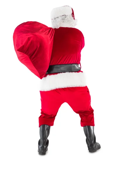 Rear view of santa holding a sack — Stock Photo, Image