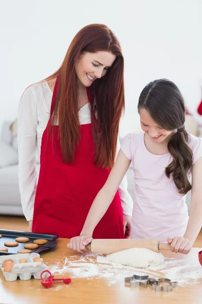 Festive mother and daughter baking together — Stock Photo, Image