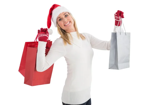 Festive blonde holding christmas gifts — Stock Photo, Image