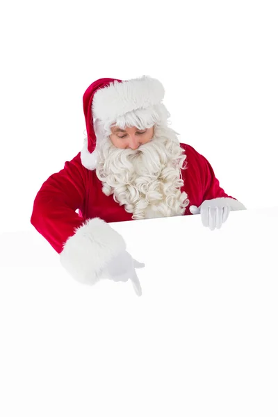 Veselý santa Clause prezentující znamení — Stock fotografie