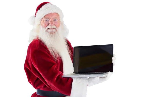 サンタ クロースは、ノート パソコンをプレゼントします。 — ストック写真