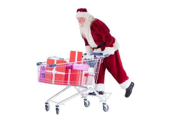 Santa monta en un carrito de compras —  Fotos de Stock