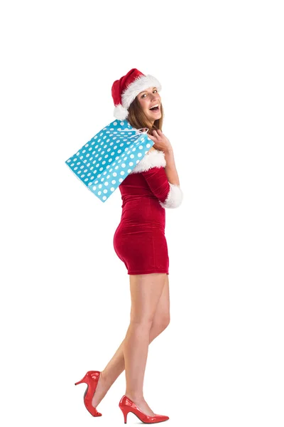 Festive brunette holding shopping bags — Stock Photo, Image