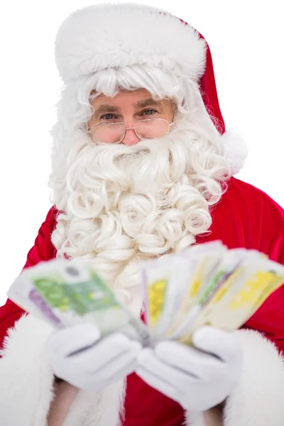 Feliz Santa Claus mostrando su dinero —  Fotos de Stock