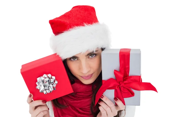 Cheerful brunette holding christmas gifts — Stock Photo, Image