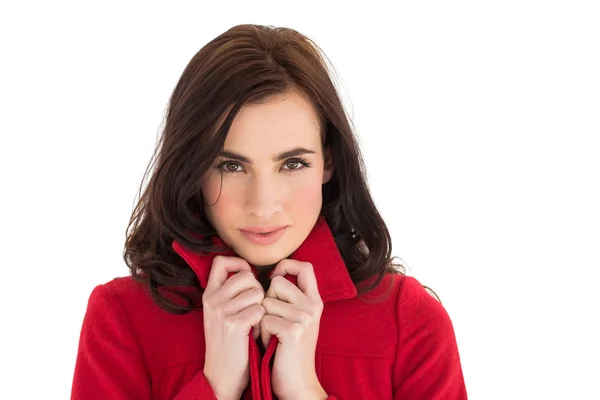Portrait of a pretty brunette in red coat — Stock Photo, Image