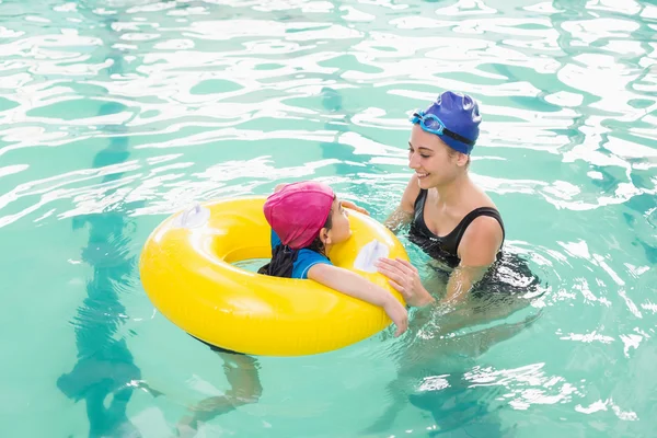 Cute little boy learning to swim with coach — Stock Photo, Image