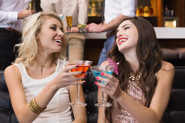 Happy friends having a drink together — Stock Photo, Image