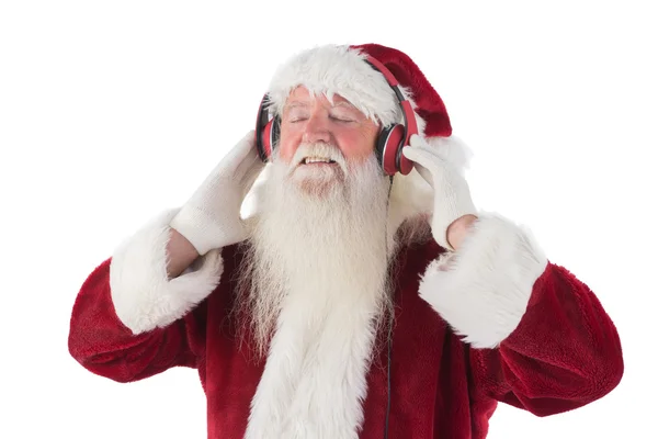 Papai Noel desfrutando de alguma música — Fotografia de Stock