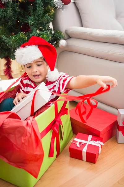 Cute boy in large christmas present Stock Image