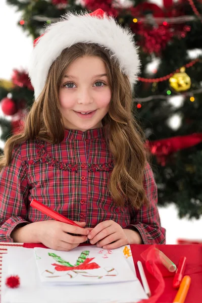 Festive little girl drawing pictures Royalty Free Stock Photos