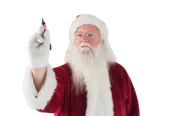 Babbo Natale scrive qualcosa con una penna — Foto Stock