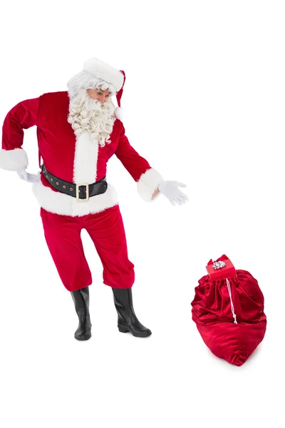 Weihnachtsmann zeigt Sack voller Geschenke — Stockfoto