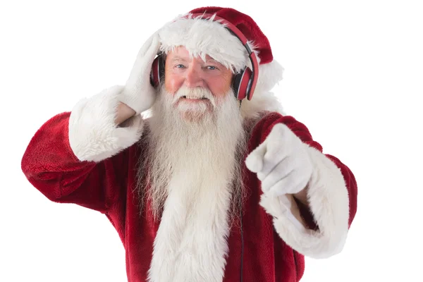 Babbo Natale sta ascoltando musica — Foto Stock