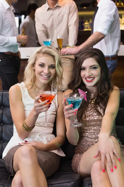 Happy friends having a drink together — Stock Photo, Image