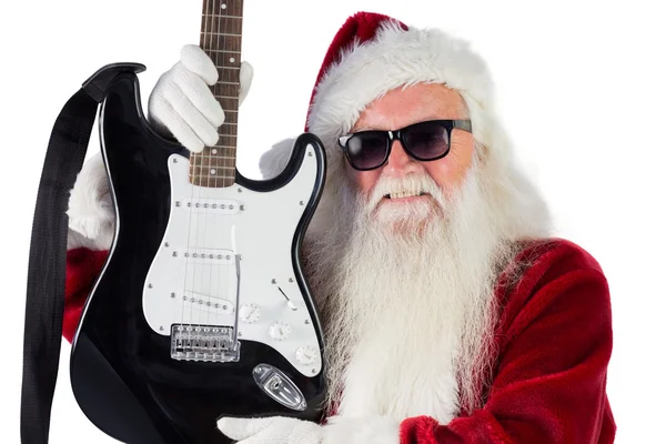 Noel Baba bir gitar gösterir — Stok fotoğraf