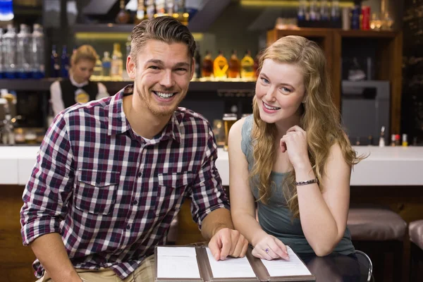 Young couple discussing the menu — Stock Photo, Image