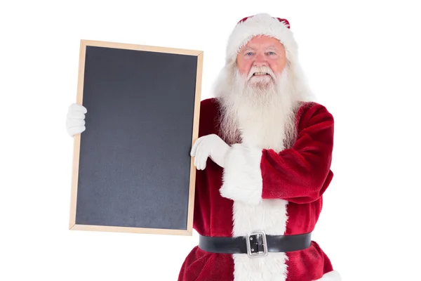 Santa sostiene una pizarra negra —  Fotos de Stock