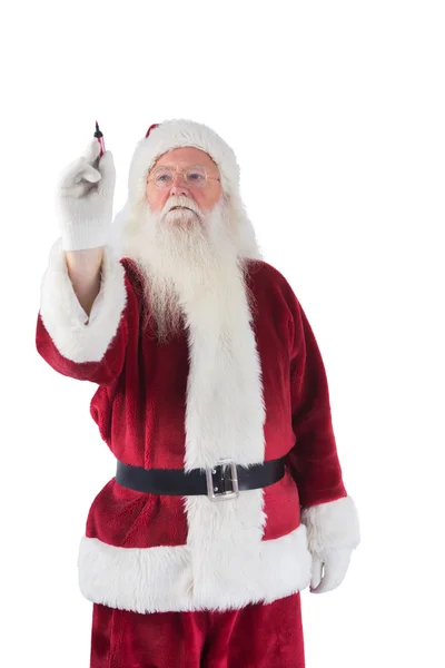 Babbo Natale scrive qualcosa con una penna — Foto Stock