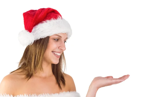 Pretty girl presenting in santa outfit — Stock Photo, Image