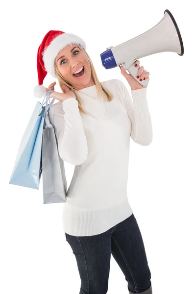 Świąteczny blondynka gospodarstwa torby prezent i megafon — Zdjęcie stockowe