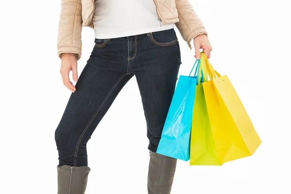 Mid section of woman holding shopping bags — Stock Photo, Image