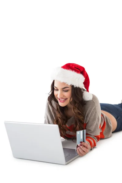 Smiling brunette shopping online with laptop — Stock Photo, Image