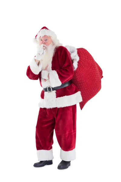 Santa pidiendo silencio con bolsa — Foto de Stock