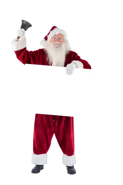 Santa holding a sign and ringing bell — Stock Photo, Image